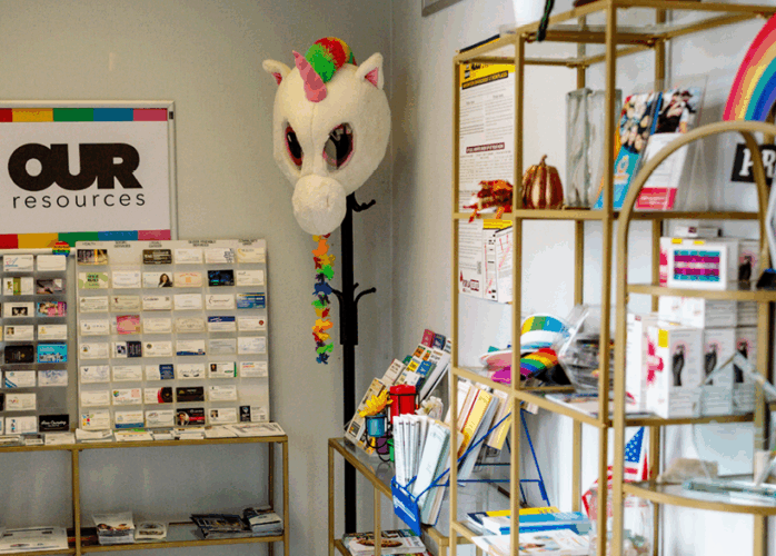 Our Center resources. there are businesses cards, shelves of pamphlets, and other information available for people to take.